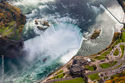 Niagara Falls Aerial View. An aerial view of the Horseshoe Falls, a part of the Niagara Falls. The falls straddle the border between America and Canada.
