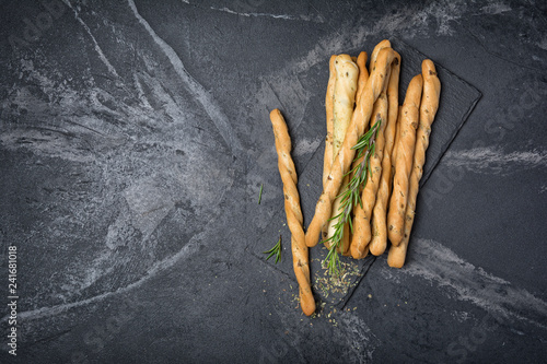 Top view of traditional italian appetizer grissini with rosemary spice