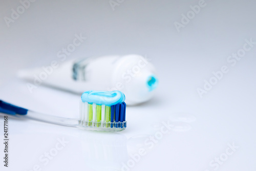 Colorful toothbrushes on a light background