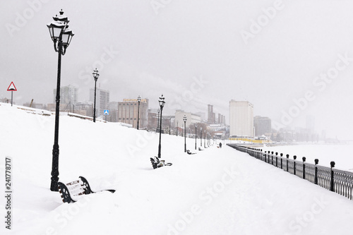 Winter city under snowfall