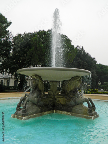 Federico Fellini Park with Fountain of Four horses in Rimini, Italy. Winter walk in the park in Italy.