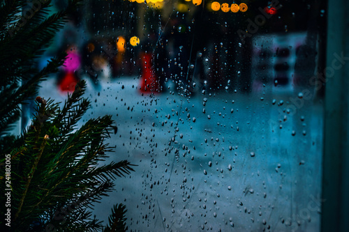 rain drops near a Christmas Tree melancholia concept heavy atmospheric emotional composition 