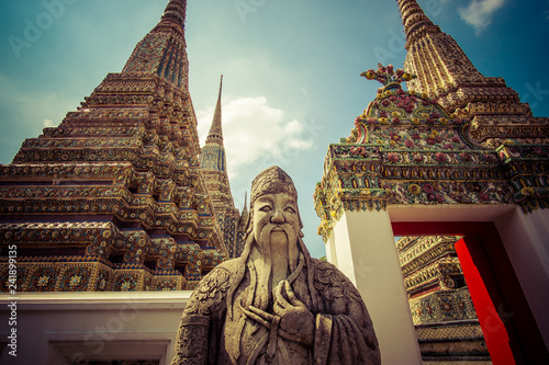 wat Pho themple in Bangkok, Thailand on sunny day outdoors.