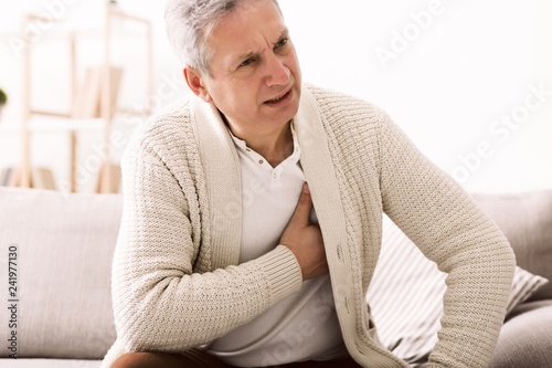 Mature man with chest pain, suffering from heart attack