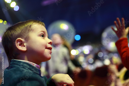 Smiling child in concert hall