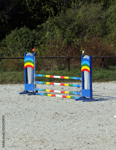 Colorful photo of equestrian obstacles. Empty field for horse jumping event competition