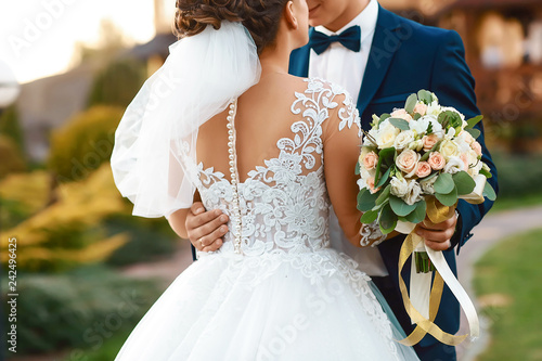 Amazing wedding couple. Pretty bride and stylish groom. selective focus