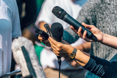 Journalists Interviewing. Female Speaker Answering Questions