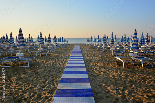 the beach is still deserted in the early morning