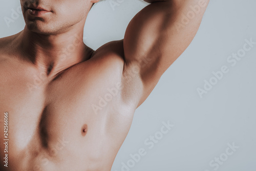 Close up of man showing his armpit while putting arm up