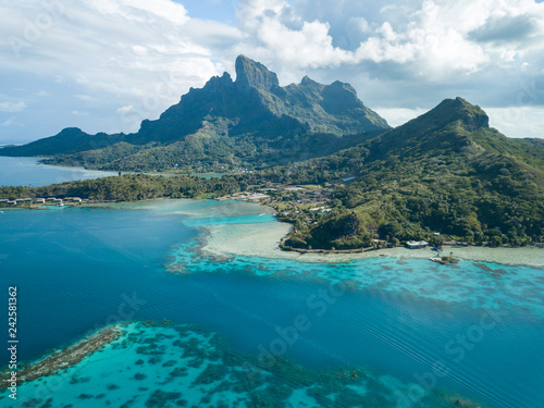 Aerial image from a drone of blue lagoon and Otemanu mountain at Bora Bora island, Tahiti, French Polynesia, South Pacific Ocean (Bora Bora Aerial).