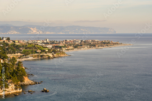 Panoramic view from above of a coastal city on the Ligurian Sea with cliffs and beaches, Albenga, Liguria, Italy