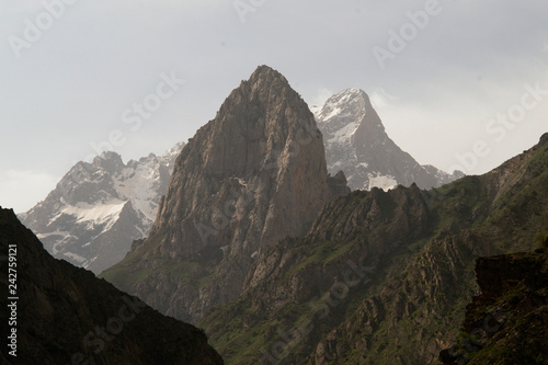 Panoramic snowy high mountains climb landscape with cloudy sky. snowy Cilo mountain for climbing in Hakkari Turkey