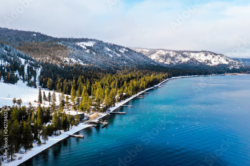 Lake Tahoe Shoreline With Snow Covered Mountains