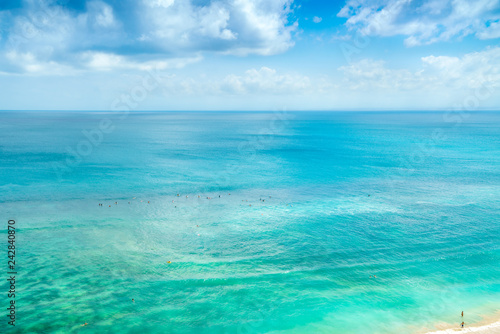Bali Luxury Resort, Coral Reef, Waves. Amazing Background in Crystal water. Top Island View in Blue Ocean in Paradise Beach. Beautiful Tropical Blue Sea Background. Aerial Paradise Island Beach View