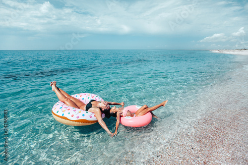 Family on lilo relaxing on the beach