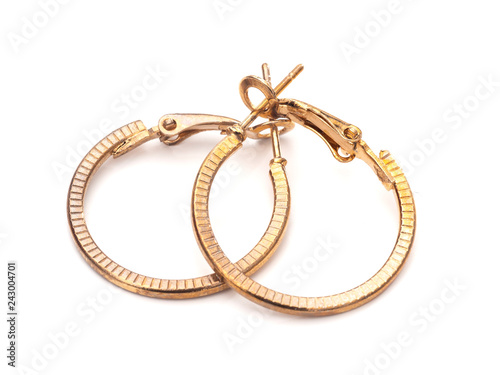 Vintage gold colour hoop earrings, pair, on white background.