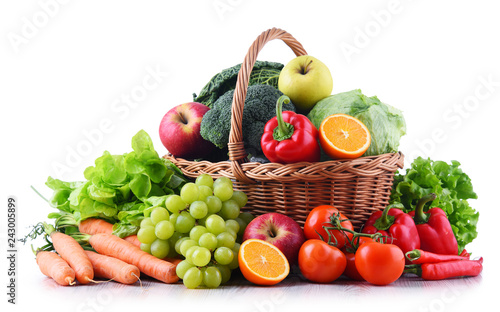 Fresh organic fruits and vegetables in wicker basket