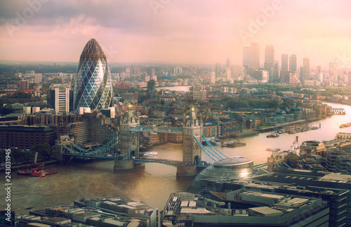 London view at sunset. Panorama include river Thames, Tower bridge and City of London and Canary Wharf buildings.