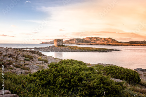 View of the sunset over the Pelosa Tower, at Sardinia. Italy.