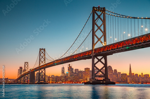 San Francisco skyline with Oakland Bay Bridge at sunset, California, USA