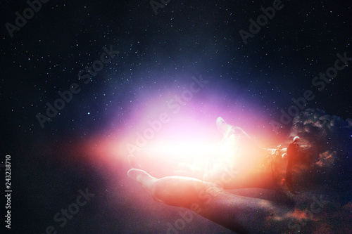 The light of the stars in the sky in the palm.