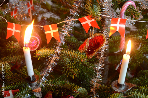 Closeup into a decorated Christmas tree decorated in retro danish style.