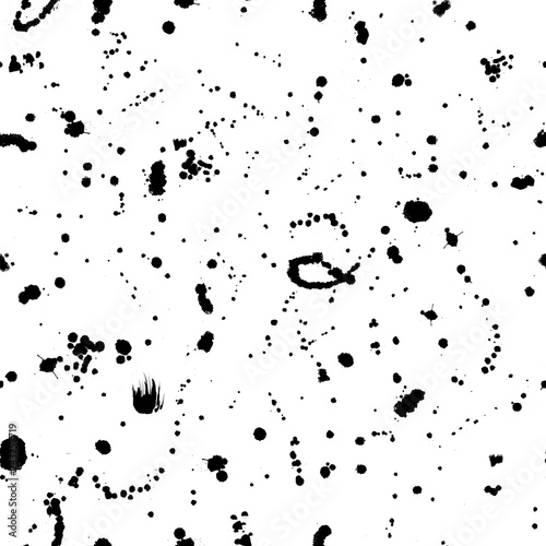 Splatter seamless pattern with ink drops and dots. Black and white artistic background