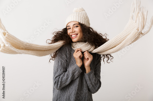 Happy young woman wearing winter clothes