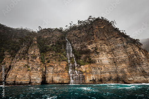 cliffs of the tasman peninsula on tasmania island, amazing coastline the highest rock cliffs in australia and the southern hemisphere , spectacular boat cruise on the rough atlantic ocean