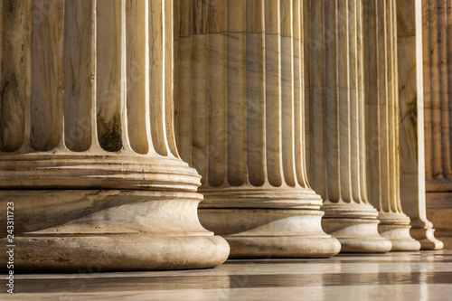 Classical marble pillars detail on the facade of a building