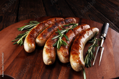 Grilled sausages with spices on a wooden table - Home-made Pork Sausages