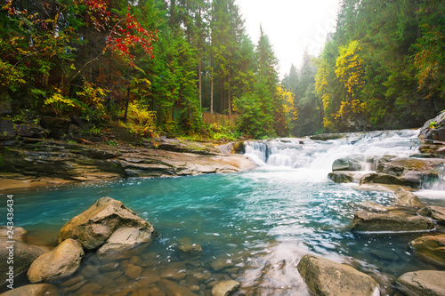 Waterfall on mountain river in the forest