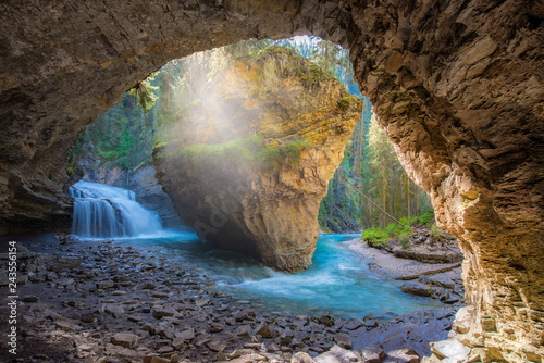 Johnston Canyon cave in Spring season with waterfalls, Johnston Canyon Trail, Alberta, Canada