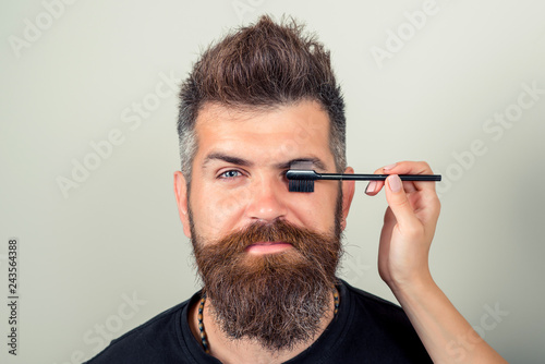 Portrait Of Sexy Male With Beard Model Face And Tweezers Near Brows. Beauty Concept. Eyebrow Correction. Closeup Of Beautiful Funny Man Plucking Eyebrows. High Resolution