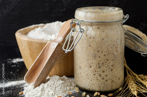 Active rye sourdough in a glass jar for homemade bread.