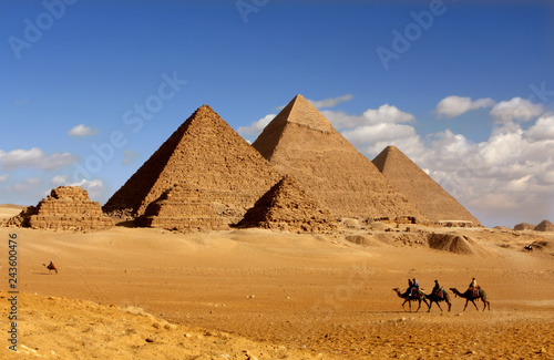 pyramids giza cairo in egypt with camel caravane panoramic scenic view