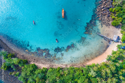 Top view of idyllic blue sea white sand beach with coconut palm tree island