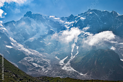 Panoramic view of the imposing east face of Monte Rosa against the light, above Macugnaga in Piedmont, Italy.