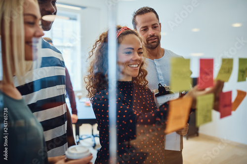 Smiling designers having a brainstorming session in an office