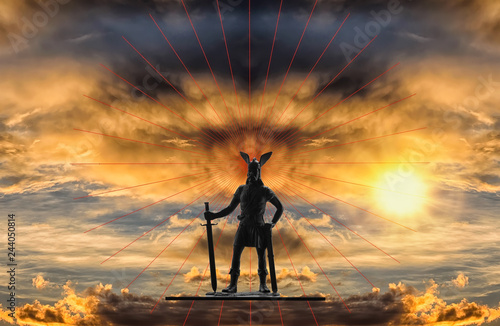 Mythical figure of Old Norse god Odin with sword against backdrop of a dramatic sky with gloomy storm clouds, red lines and bright rising sun, Viking theme, creative illustration