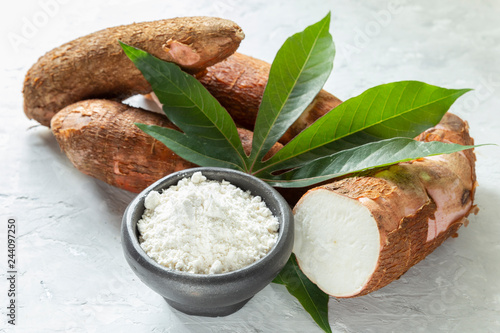 Raw yucca starch on the wooden table - Manihot esculenta.