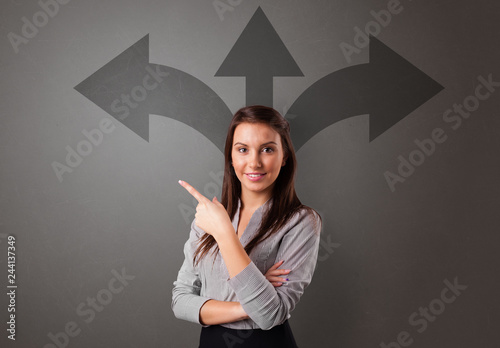 Business person choosing between two directions