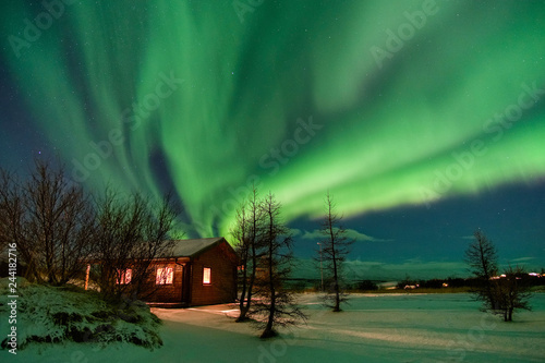 Aurora over cottage in Iceland