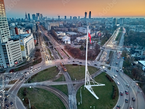 WARSAW, POLAND - NOVEMBER 17, 2018: Beautiful panoramic aerial drone view to "Babka" roundabout with a large national Polish flag on a high mast located in Warsaw, Poland, from drone