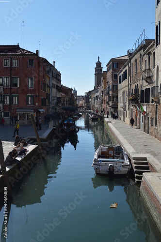 Narrow And Beautiful Channels With Atos Buildings To The Sides In Venice. Travel, holidays, architecture. March 28, 2015. Venice, Veneto region, Italy.