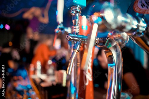 Close up of golden beer tap with blurred background