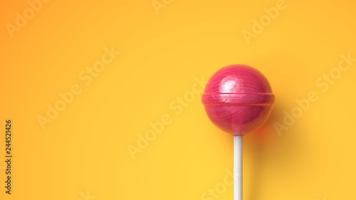 Sweet lollipop on bright yellow background with copy space