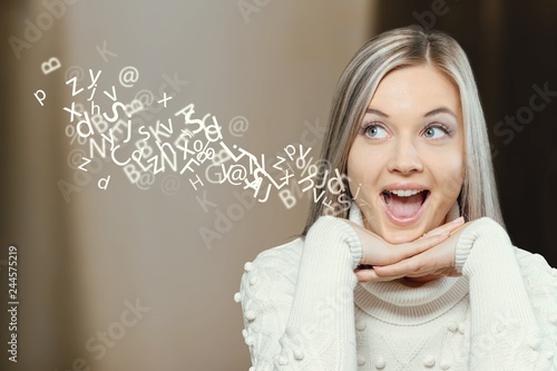 Woman talking with alphabet letters.