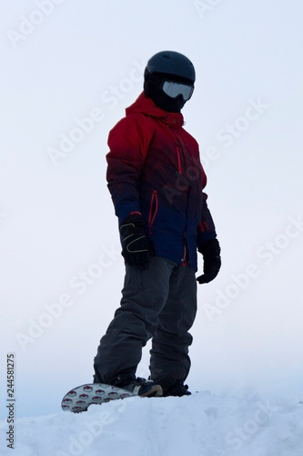 snowboarder on a ski slope in the snow